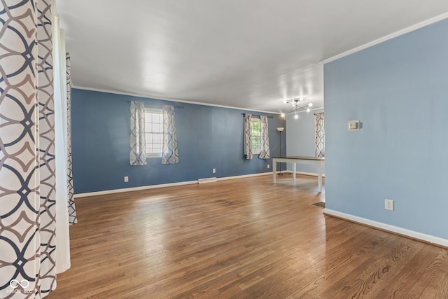 308 Hickory Hill Dr, Terre Haute, IN 47802 - spare room featuring ornamental molding, wood finished floors, and baseboards