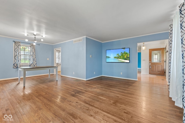308 Hickory Hill Dr, Terre Haute, IN 47802 - unfurnished living room with ornamental molding, wood finished floors, and baseboards