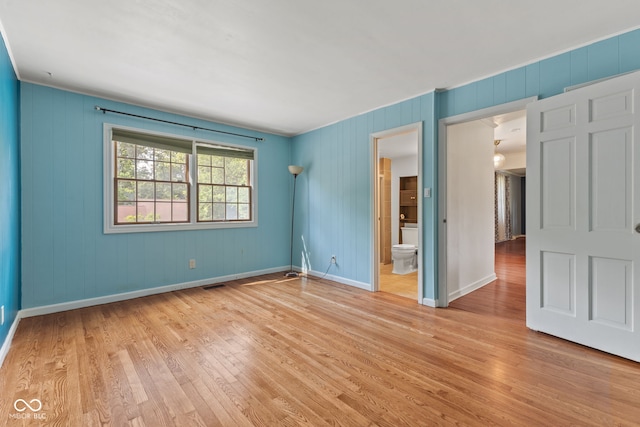 308 Hickory Hill Dr, Terre Haute, IN 47802 - unfurnished bedroom with light wood-type flooring, baseboards, and connected bathroom