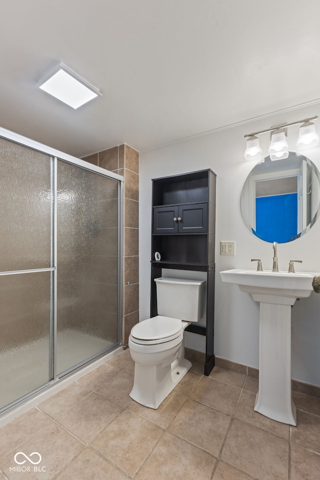 308 Hickory Hill Dr, Terre Haute, IN 47802 - bathroom with toilet, a stall shower, tile patterned flooring, and baseboards