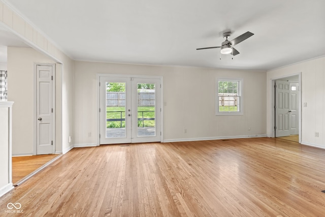 308 Hickory Hill Dr, Terre Haute, IN 47802 - empty room featuring light wood-type flooring, a ceiling fan, baseboards, ornamental molding, and french doors
