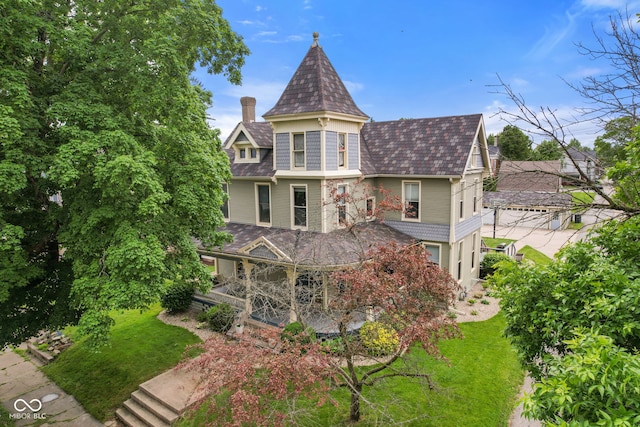 511 N Perkins St, Rushville, IN 46173 - rear view of house with a lawn