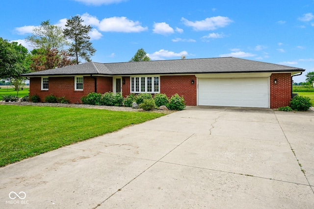 7447 S 25 E, Pendleton, IN 46064 - single story home featuring a garage, concrete driveway, brick siding, and a front yard