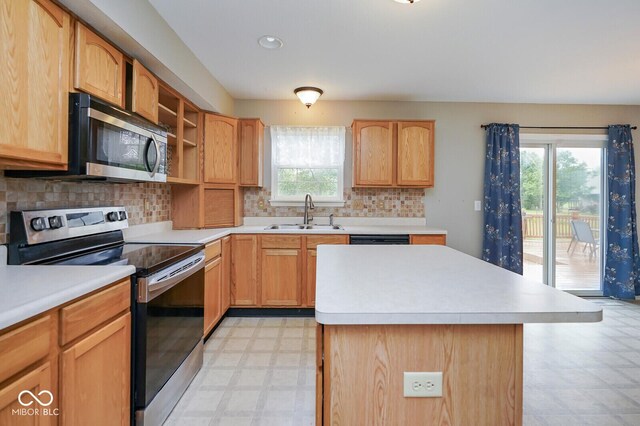 11198 N 650 W, Fountaintown, IN 46130 - kitchen featuring appliances with stainless steel finishes, a sink, light flooring, light countertops, and tasteful backsplash