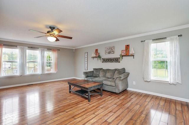 11198 N 650 W, Fountaintown, IN 46130 - living area featuring healthy amount of natural light, a ceiling fan, light wood-style flooring, and crown molding