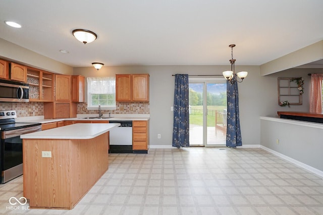 11198 N 650 W, Fountaintown, IN 46130 - kitchen featuring appliances with stainless steel finishes, a sink, light countertops, and backsplash