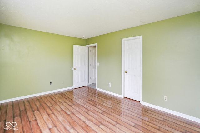 11198 N 650 W, Fountaintown, IN 46130 - unfurnished bedroom featuring light wood-type flooring and baseboards