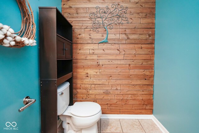 11198 N 650 W, Fountaintown, IN 46130 - half bathroom with toilet, tile patterned floors, baseboards, and wooden walls