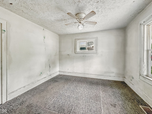 3526 E Vermont St, Indianapolis, IN 46201 - carpeted empty room featuring a ceiling fan and a textured ceiling