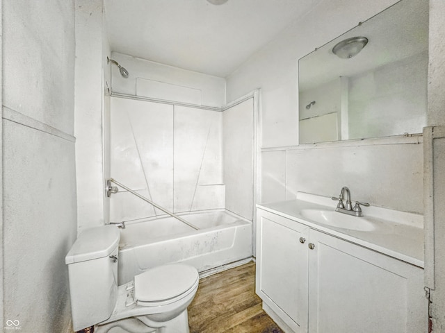 3526 E Vermont St, Indianapolis, IN 46201 - bathroom with toilet, vanity, wood finished floors, and tub / shower combination