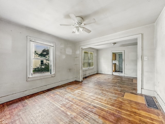 3526 E Vermont St, Indianapolis, IN 46201 - unfurnished room with a ceiling fan, wood finished floors, and baseboards