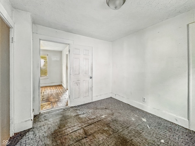 3526 E Vermont St, Indianapolis, IN 46201 - unfurnished room with a textured ceiling