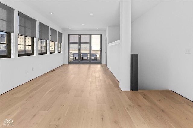 1818 N Pennsylvania St, Indianapolis, IN 46202 - spare room featuring light wood-type flooring and recessed lighting
