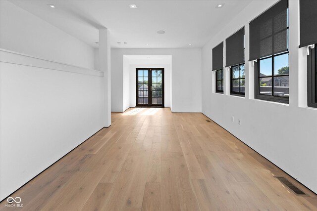 1818 N Pennsylvania St, Indianapolis, IN 46202 - spare room with light wood-style floors, french doors, and recessed lighting