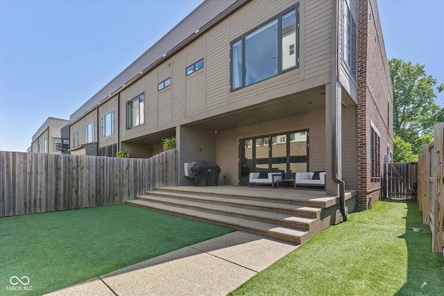 1818 N Pennsylvania St, Indianapolis, IN 46202 - rear view of house featuring a patio area and outdoor lounge area
