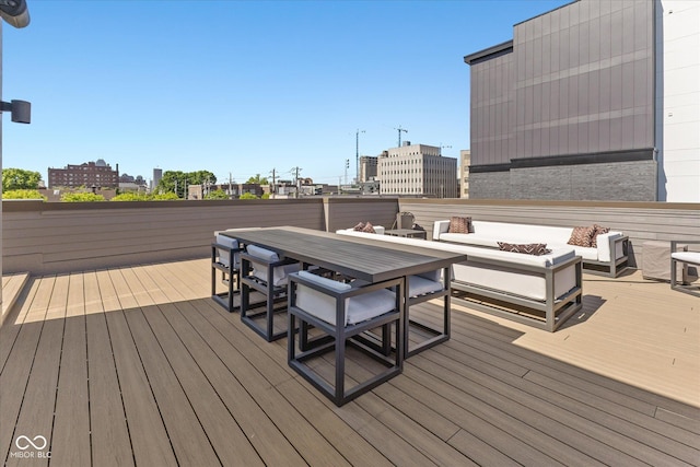 1818 N Pennsylvania St, Indianapolis, IN 46202 - wooden terrace with an outdoor fire pit, outdoor dining area, and a city view