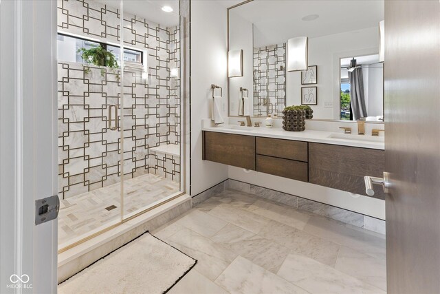 1818 N Pennsylvania St, Indianapolis, IN 46202 - full bathroom featuring a shower stall, double vanity, and healthy amount of natural light