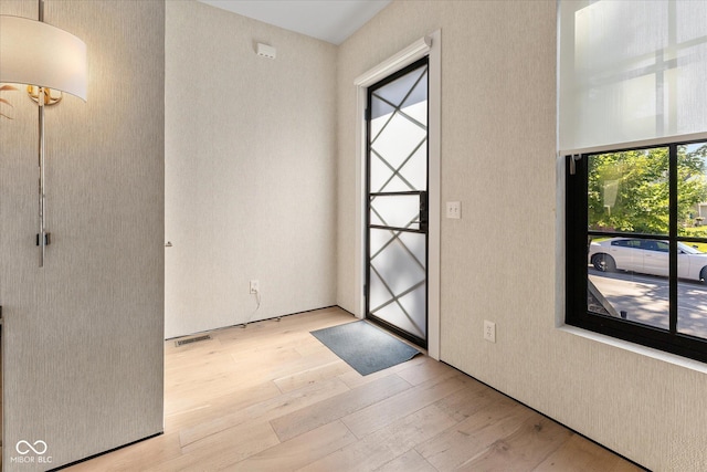 1818 N Pennsylvania St, Indianapolis, IN 46202 - entryway with light wood-style floors