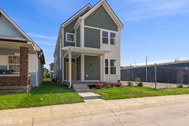 1405 Deloss St, Indianapolis, IN 46201 - view of front facade with covered porch, board and batten siding, and central air condition unit