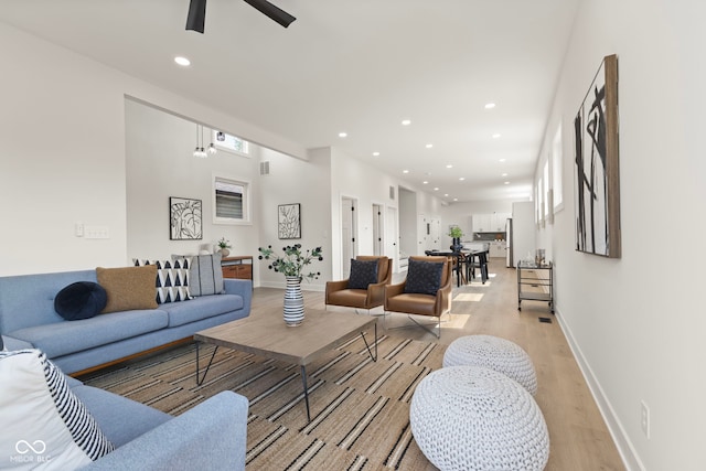 1405 Deloss St, Indianapolis, IN 46201 - living room with light wood-style flooring, ceiling fan, recessed lighting, and baseboards