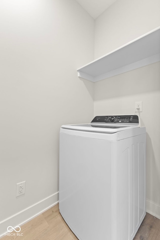 1405 Deloss St, Indianapolis, IN 46201 - washroom featuring washer / dryer, wood finished floors, and baseboards
