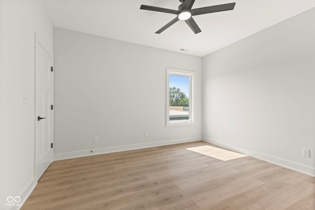 1405 Deloss St, Indianapolis, IN 46201 - empty room featuring ceiling fan, light wood-style floors, and baseboards