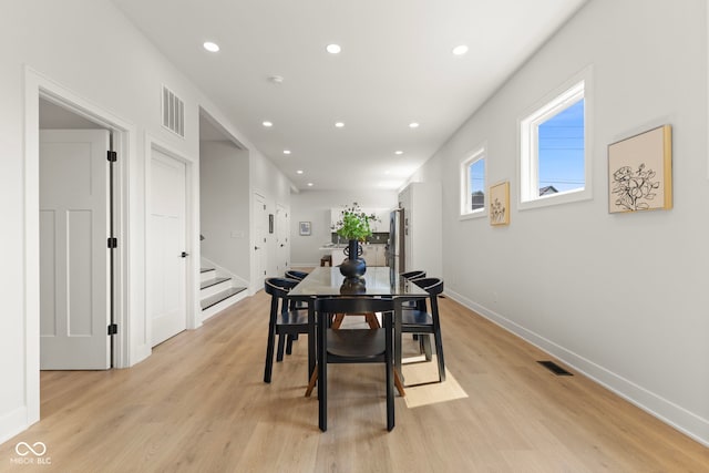 1405 Deloss St, Indianapolis, IN 46201 - dining space with stairs, recessed lighting, light wood finished floors, and baseboards