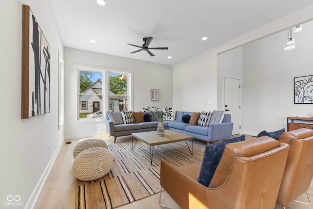1405 Deloss St, Indianapolis, IN 46201 - living room featuring a ceiling fan, baseboards, recessed lighting, and light wood finished floors