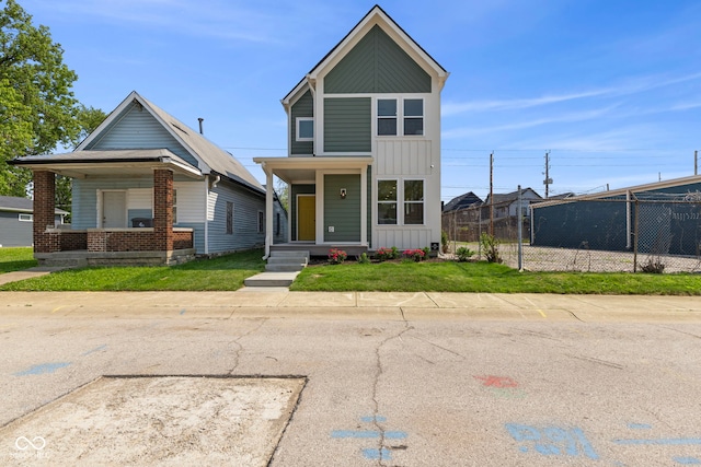 1405 Deloss St, Indianapolis, IN 46201 - view of front facade with covered porch and board and batten siding