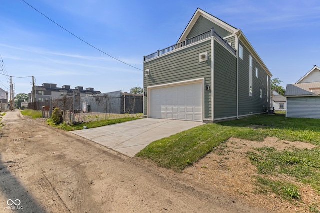 1405 Deloss St, Indianapolis, IN 46201 - view of property exterior with an attached garage and driveway