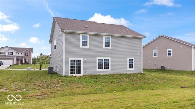 6507 W Whispering Way, Greenfield, IN 46140 - rear view of house featuring a lawn and cooling unit