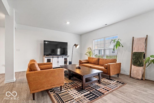 6507 W Whispering Way, Greenfield, IN 46140 - living area with light wood-style floors, baseboards, and recessed lighting