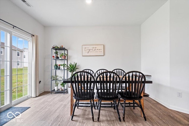 6507 W Whispering Way, Greenfield, IN 46140 - dining area featuring wood finished floors and baseboards