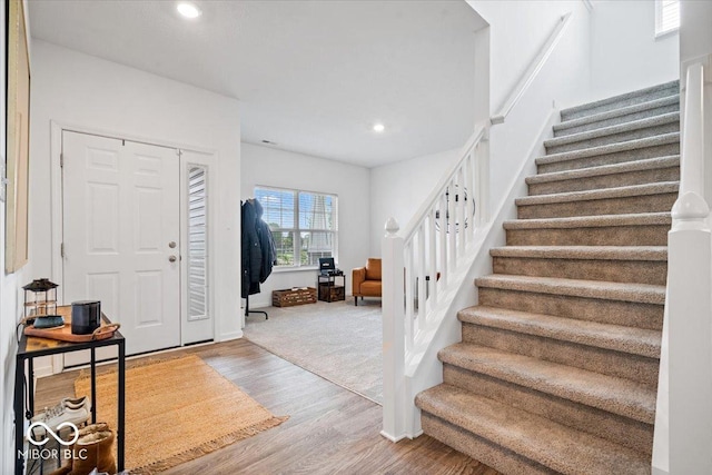 6507 W Whispering Way, Greenfield, IN 46140 - foyer entrance with stairs, wood finished floors, recessed lighting, and baseboards