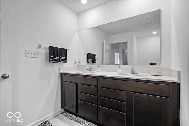 6507 W Whispering Way, Greenfield, IN 46140 - bathroom with double vanity and baseboards