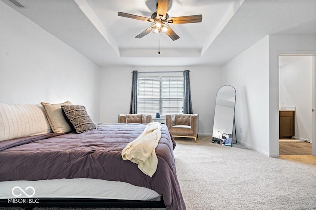 6507 W Whispering Way, Greenfield, IN 46140 - bedroom featuring a tray ceiling, carpet floors, baseboards, and ceiling fan