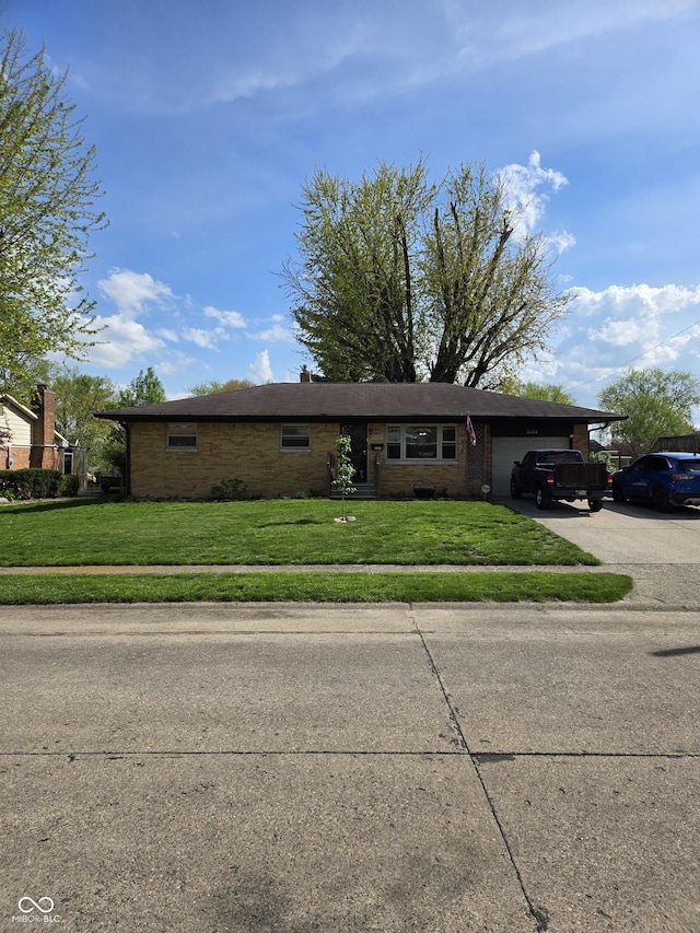 6133 Ashway Ct, Indianapolis, IN 46224 - ranch-style house with a garage, concrete driveway, a front yard, and brick siding
