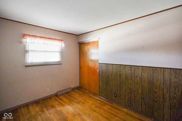 6133 Ashway Ct, Indianapolis, IN 46224 - empty room with wood finished floors and ornamental molding