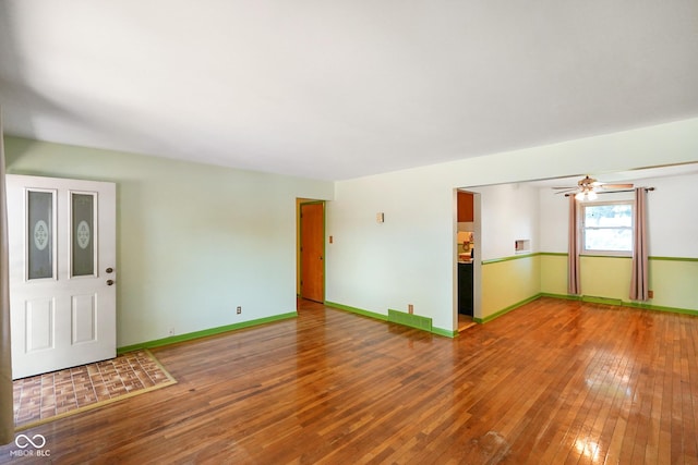 6133 Ashway Ct, Indianapolis, IN 46224 - unfurnished living room with wood-type flooring and ceiling fan