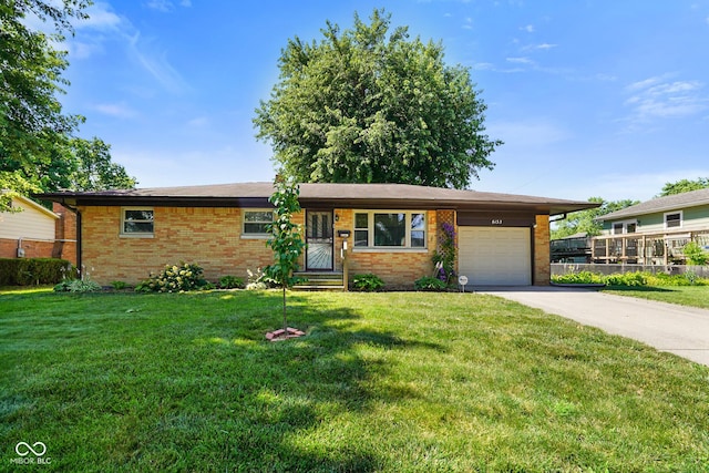 6133 Ashway Ct, Indianapolis, IN 46224 - ranch-style home with a garage, brick siding, concrete driveway, and a front lawn
