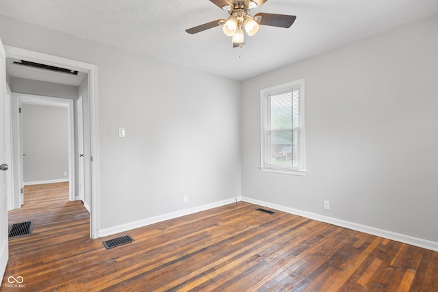 2164 E Raymond St, Indianapolis, IN 46203 - spare room with wood-type flooring, baseboards, and ceiling fan