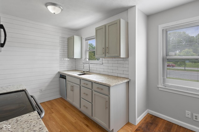 2164 E Raymond St, Indianapolis, IN 46203 - kitchen with range with electric stovetop, a sink, light wood-style flooring, backsplash, and gray cabinetry