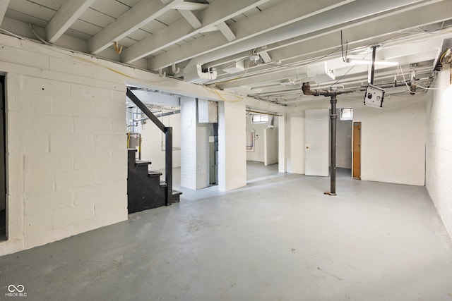 2164 E Raymond St, Indianapolis, IN 46203 - basement featuring stairs and concrete block wall