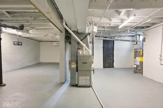 2164 E Raymond St, Indianapolis, IN 46203 - unfinished below grade area with water heater, heating unit, and concrete block wall