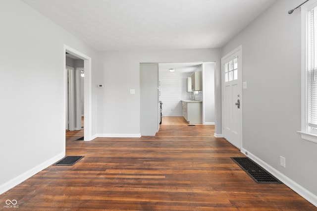 2164 E Raymond St, Indianapolis, IN 46203 - foyer with plenty of natural light, baseboards, and wood finished floors
