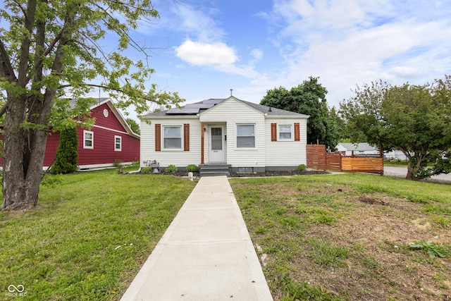 2164 E Raymond St, Indianapolis, IN 46203 - bungalow-style home featuring solar panels