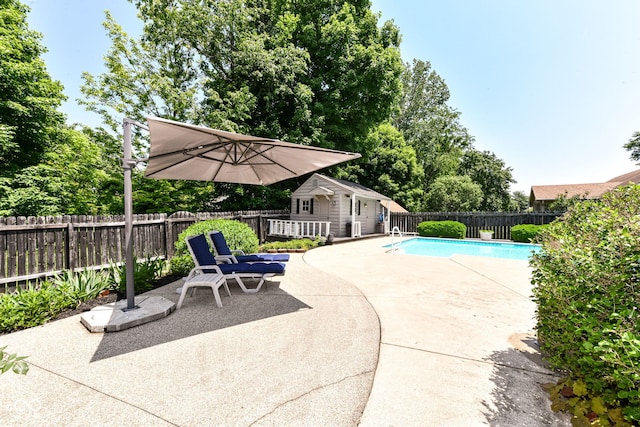 6580 Kings Ct, Avon, IN 46123 - view of pool with a patio area, a fenced backyard, an outdoor structure, and an exterior structure