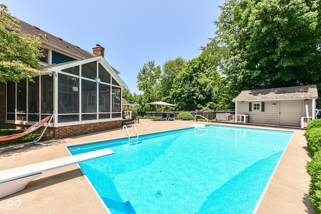 6580 Kings Ct, Avon, IN 46123 - view of swimming pool featuring a diving board, a sunroom, an outdoor structure, and a patio