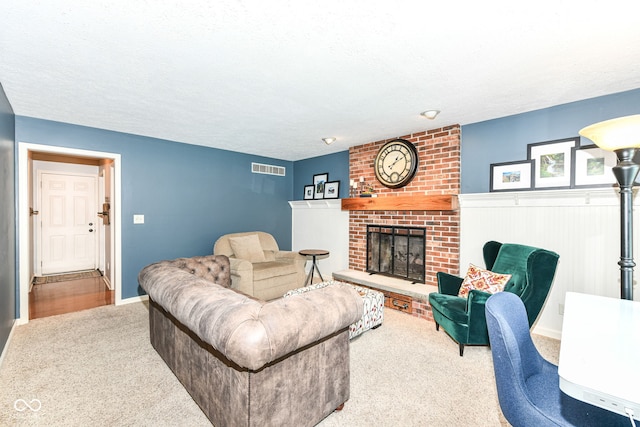 6580 Kings Ct, Avon, IN 46123 - carpeted living area featuring a brick fireplace and a textured ceiling