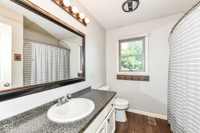 6580 Kings Ct, Avon, IN 46123 - bathroom with vanity, wood finished floors, and a textured ceiling